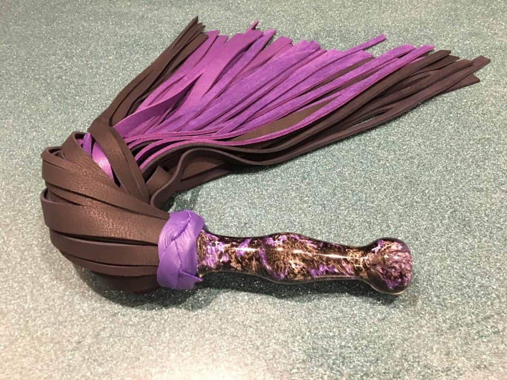 Cassie's new purple and black flogger from Holo whips